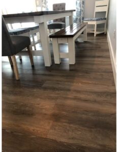 Laminate flooring in dining room | West Michigan Carpet Center